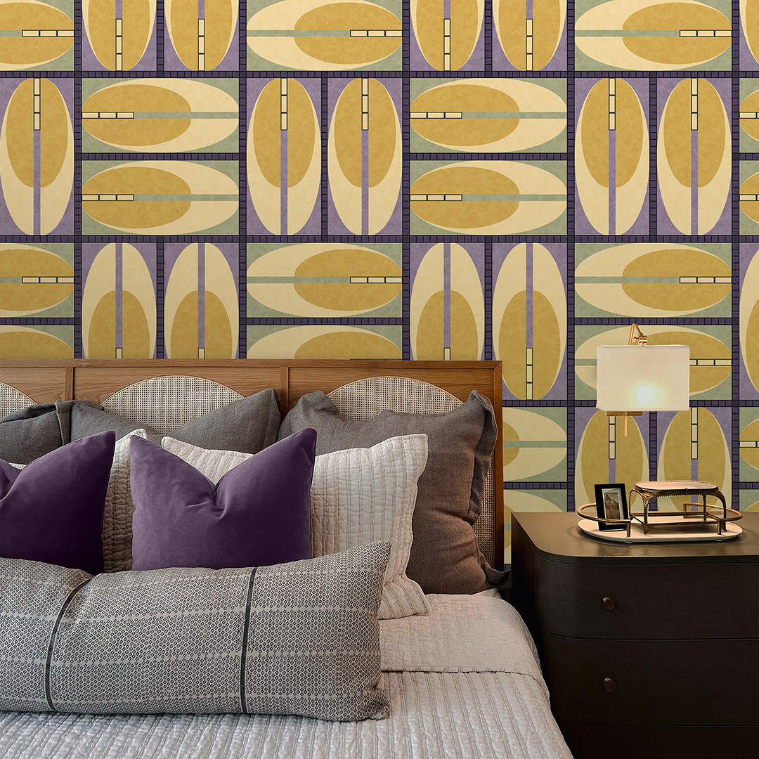 The artwork features a repeating geometric pattern of symmetrical shapes resembling elongated, curved diamonds or petals in various shades of blue and green. Each shape is split vertically with one half filled with a light blue and the other half filled with green or darker blue. The background is a light, almost pastel blue, which provides a soft yet vibrant backdrop. One of the blue shapes near the upper left contains a white starburst element, adding a focal point of brightness to the composition. The overall design conveys a modern, mid-century aesthetic with clean lines and harmonious color contrasts.